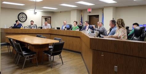 Council authorizes mayor to get loan for school buildings.